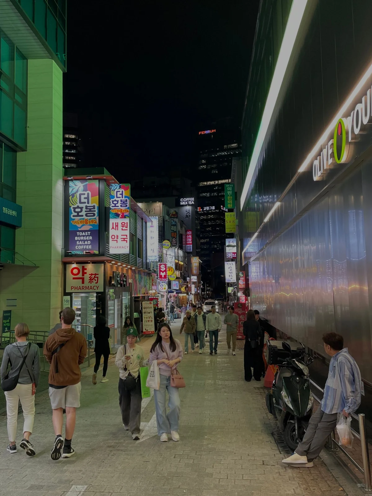 A brightly lit Myeongdong shopping street at night