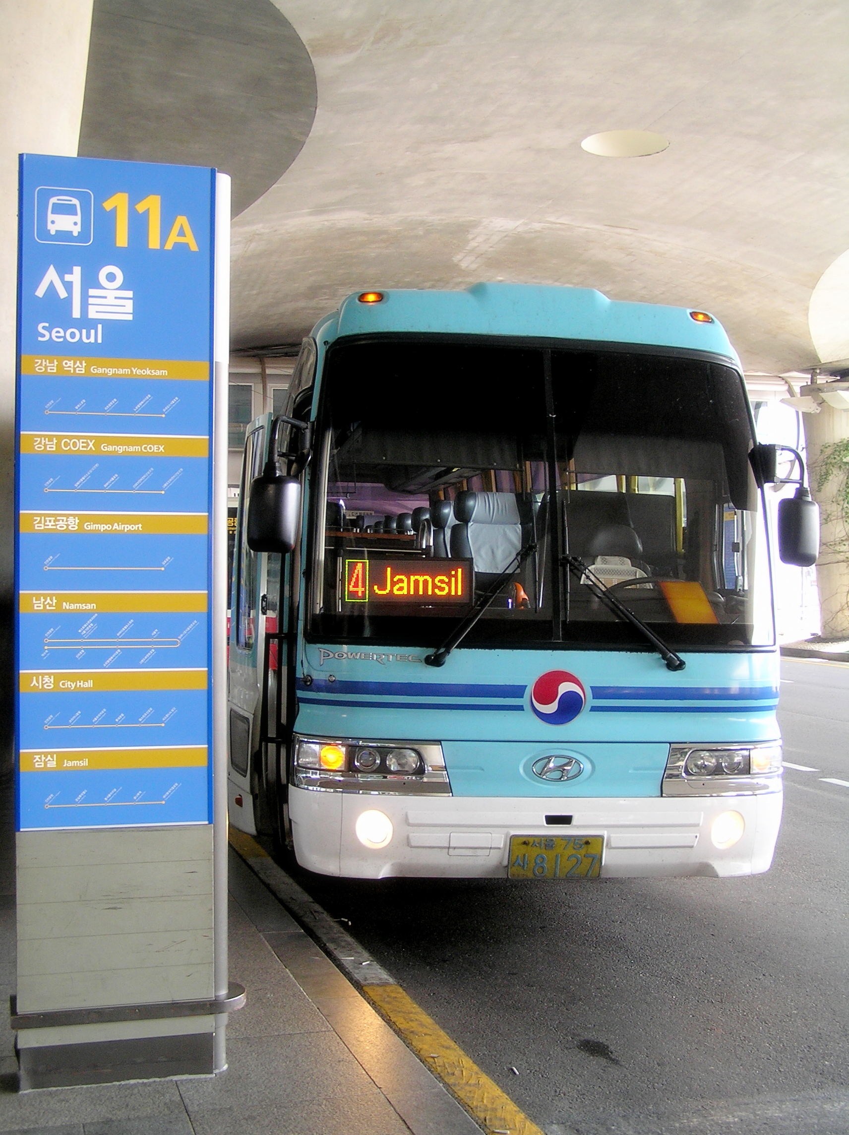 An airport limousine bus beside a curb at Incheon International Airport