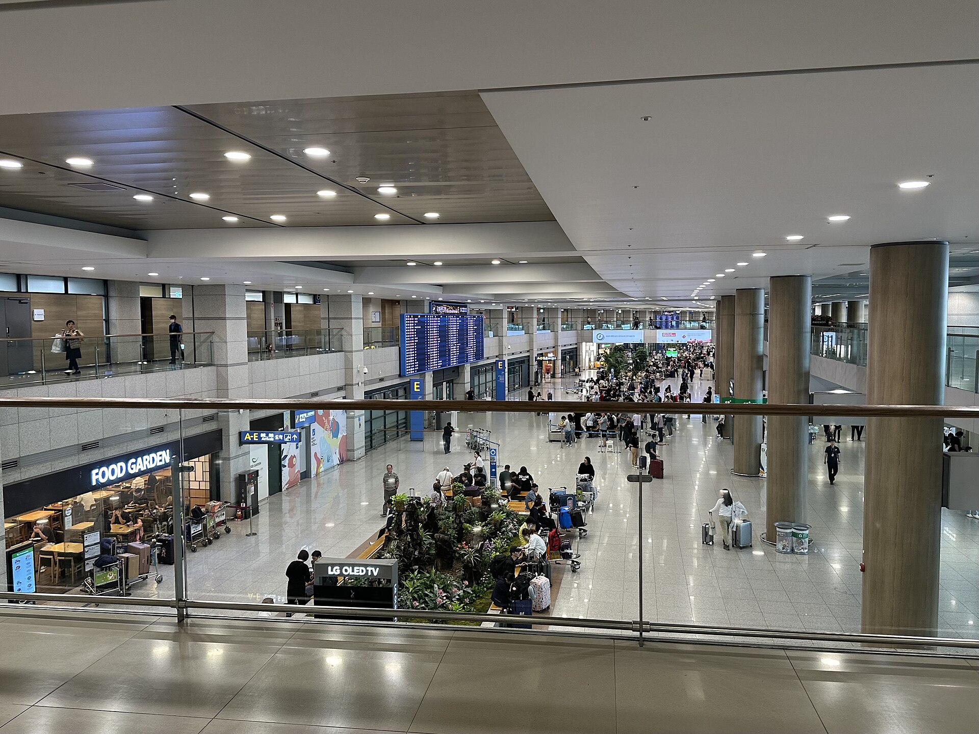 Arrival hall and signs inside Incheon International Airport Terminal 1