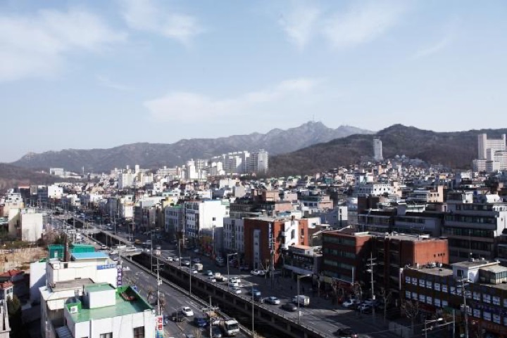 Gwanaksan mountain range behind Seoul residential district